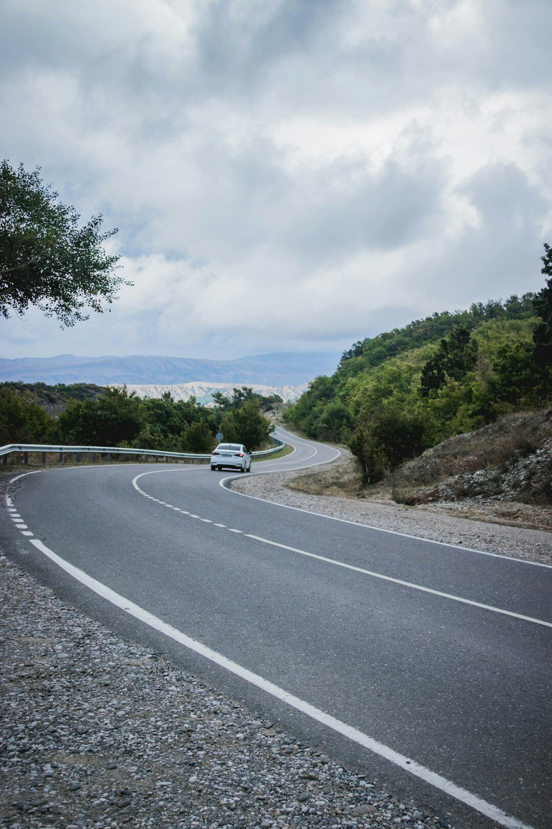 luxury car on winding road