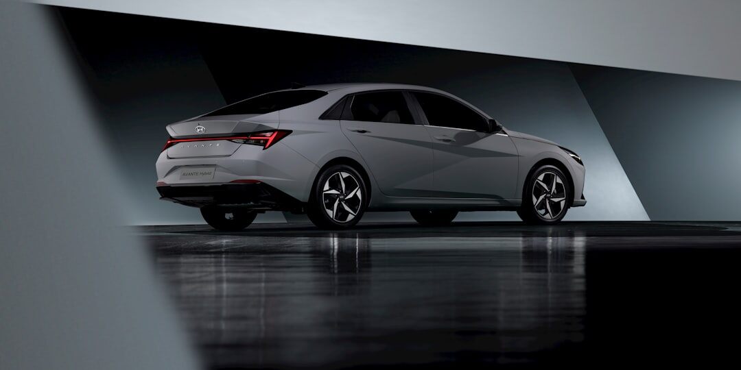 Metallic silver sedan on a clean studio background