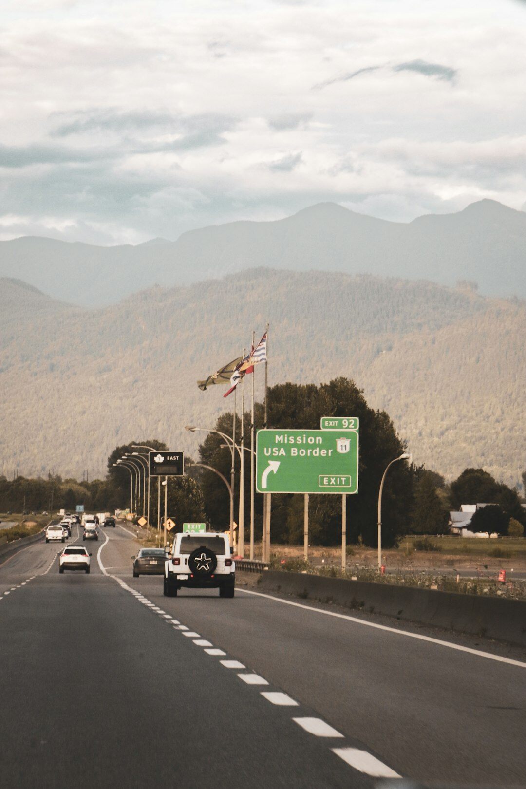 American highway with a modern car and city skyline