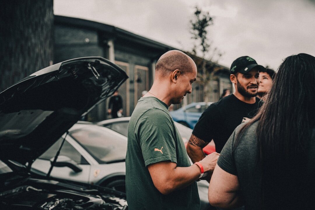 car mechanic advising customer