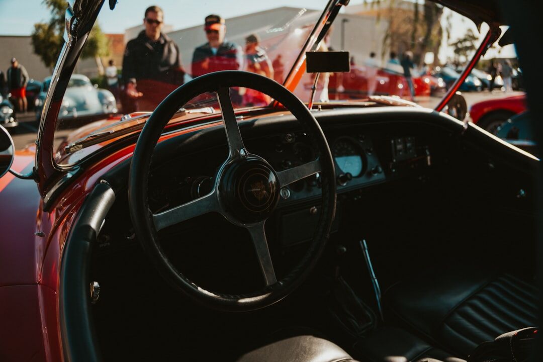 person driving classic car