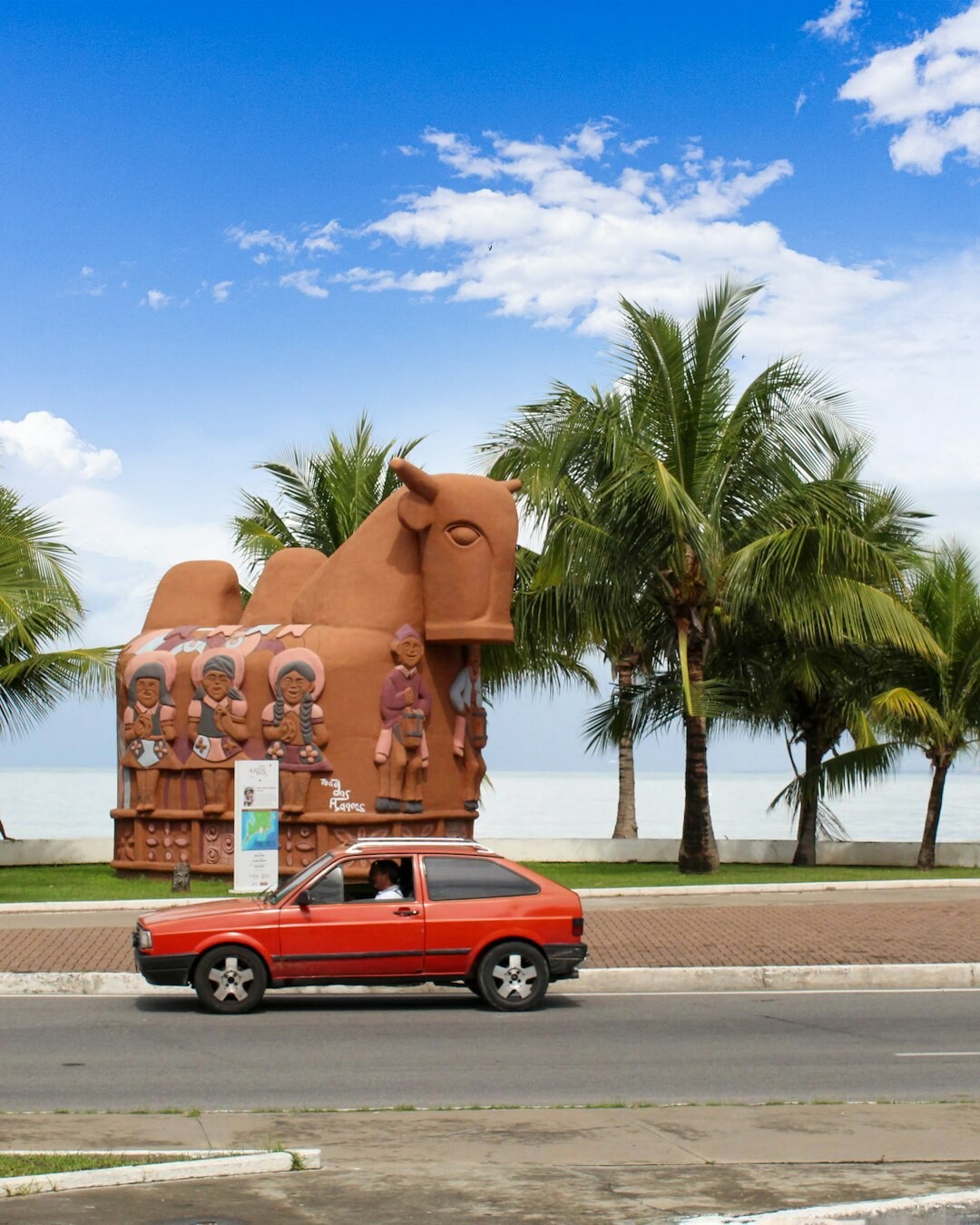 Modern car on a tropical coastal road in Brazil