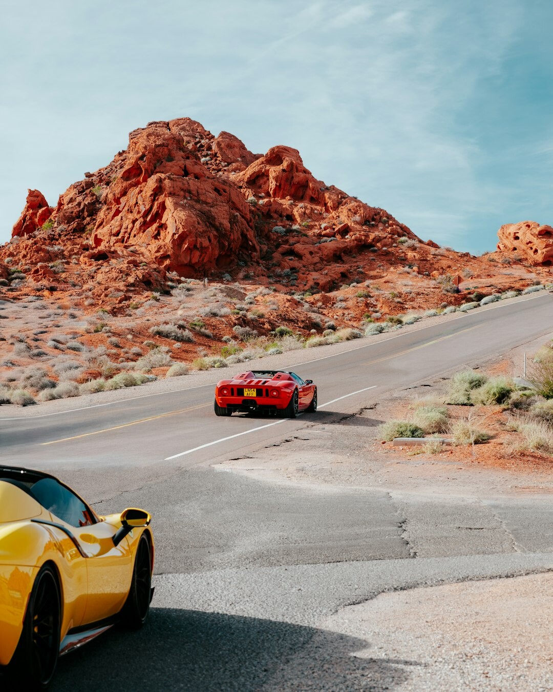 Red sports car on an open highway